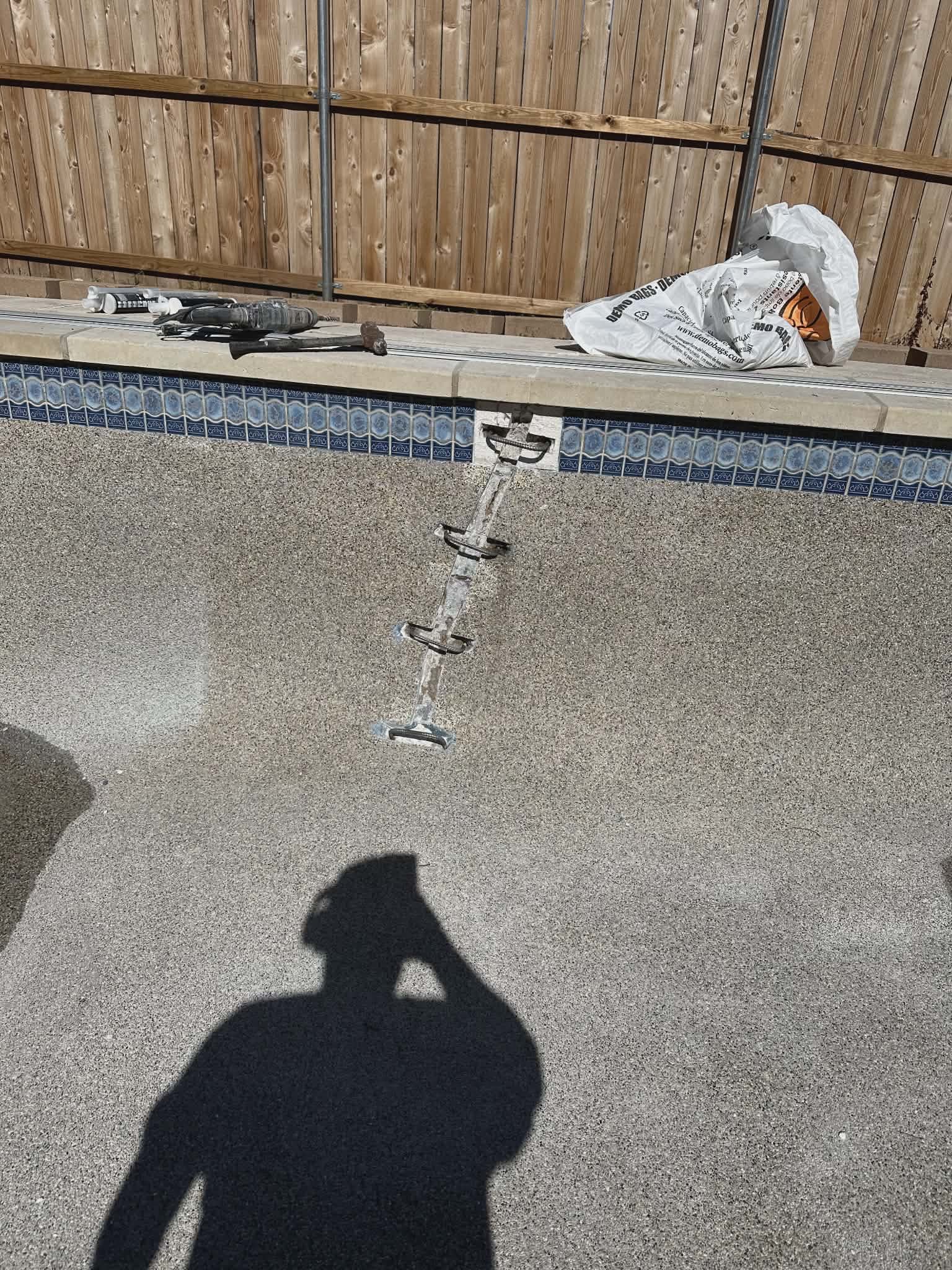 Pool crack repair - repaired crack line with staples